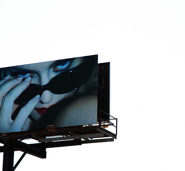 Billboard advertising sunglasses above Melrose Avenue