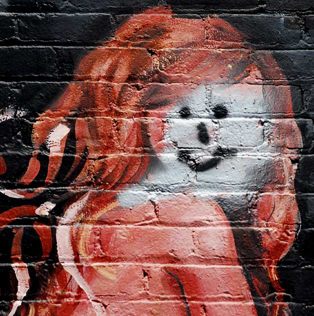 Defaced mural in alley behind Melrose Avenue