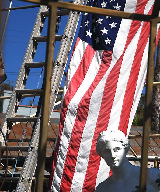 Flag and White Goddess - display yard at Nick Metropolis - La Brea and First, Los Angeles