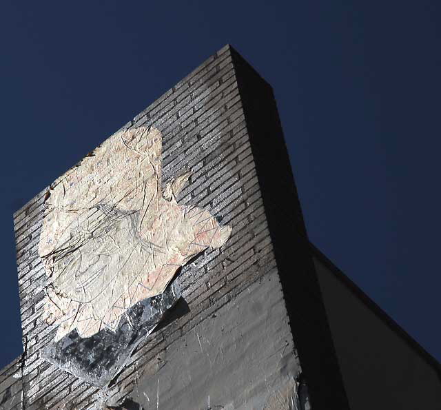 Face graphic on brick wall, southwest corner of La Brea and First, Los Angeles