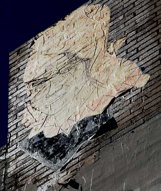 Face graphic on brick wall, southwest corner of La Brea and First, Los Angeles
