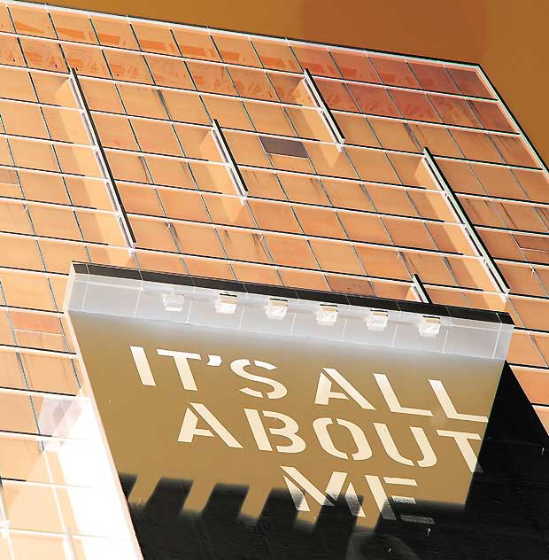 "It's All About Me" - advertising graphic on the west wall of the Sunset-Vine Tower