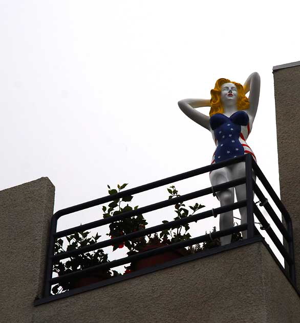 Fiberglass All-American Bathing Beauty figure above Speedway, Venice Beach