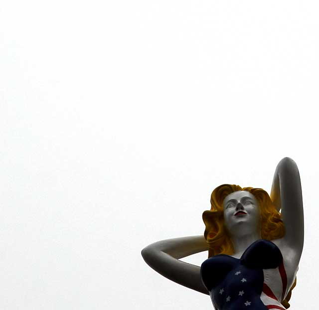 Fiberglass All-American Bathing Beauty figure above Speedway, Venice Beach