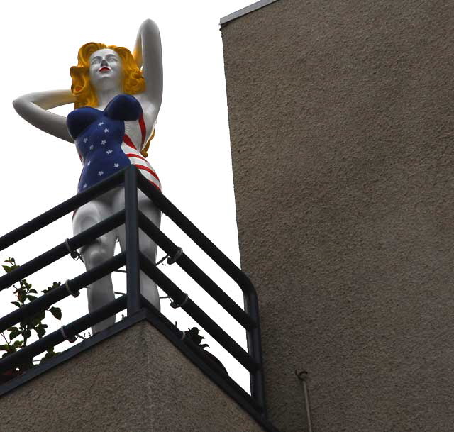 Fiberglass All-American Bathing Beauty figure above Speedway, Venice Beach