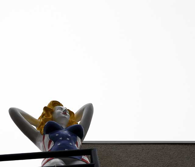 Fiberglass All-American Bathing Beauty figure above Speedway, Venice Beach