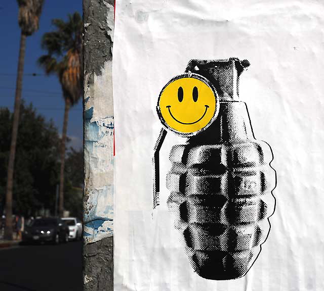 Grenade and Smiley Face, graphic on utility box