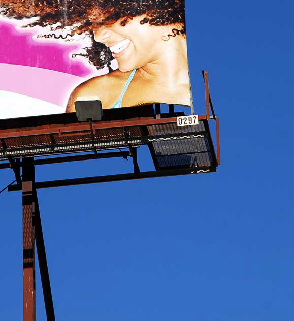 "Curls" billboard above Hollywood Boulevard