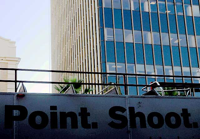 Bank graphic on Hollywood Tour Bus ("Point. Shoot. Deposit.") 