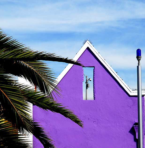 At the base of the Santa Monica Pier, under the bridge, a row of color on Ocean Front 