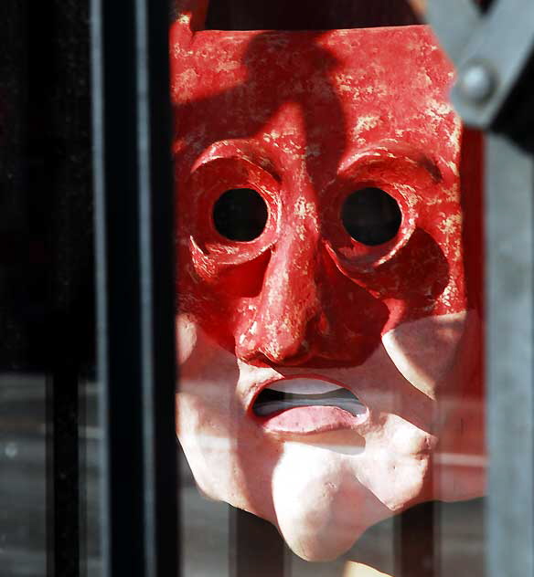 Mask in shop window at "Fake" - at Heliotrope and Melrose