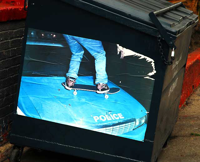 Skateboarding Graphic on Dumpster