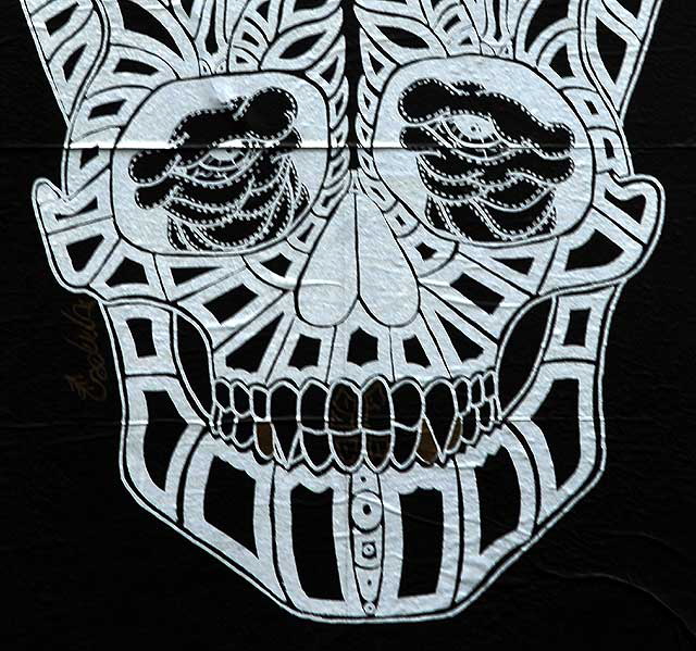 Skull graphic in parking lot, Melrose Avenue