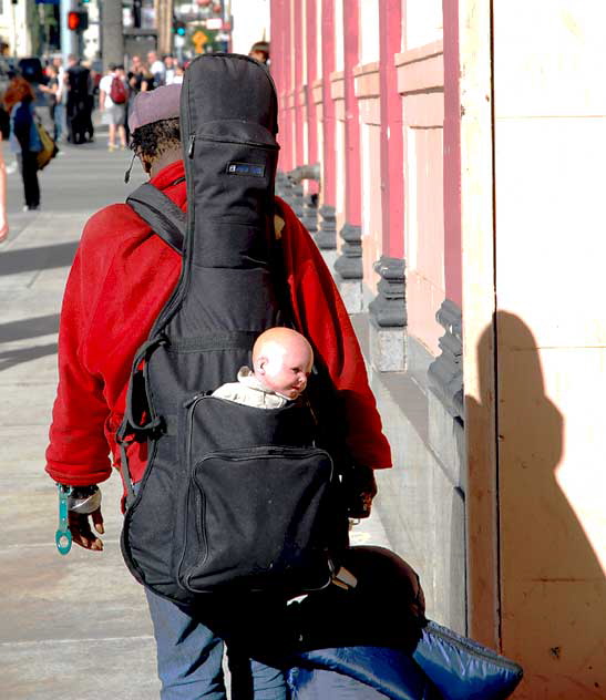 Homeless woman with plastic baby, Highland Avenue, Hollywood, Friday, January 21, 2011