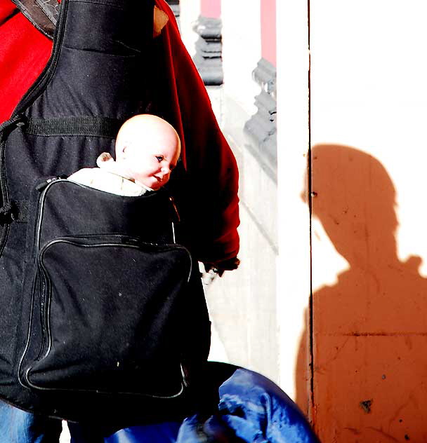 Homeless woman with plastic baby, Highland Avenue, Hollywood, Friday, January 21, 2011