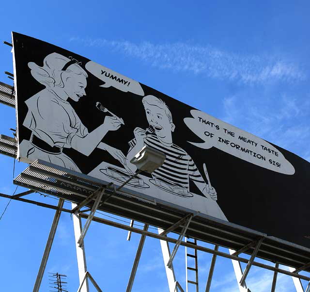 "Yummy" - "That's the Meaty Taste of Information, Sis" - KFI billboard, La Brea south of Wilshire Boulevard, photographed Monday, February 28, 2011