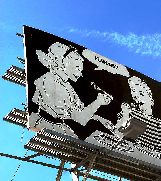 "Yummy" - "That's the Meaty Taste of Information, Sis" - KFI billboard, La Brea south of Wilshire Boulevard, photographed Monday, February 28, 2011