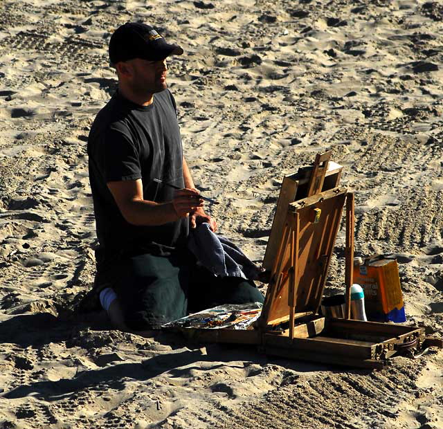 Painter on the beach at the Venice Beach Pier, Wednesday, February 9, 2011