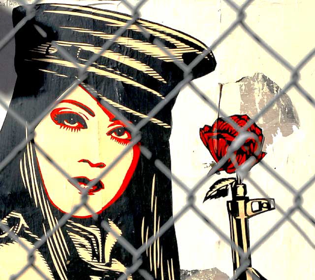 Shepard Fairey "Obey" graphic behind a chain-link fence at an abandoned restaurant, Sunset Boulevard at Gordon, Friday, February 11, 2011