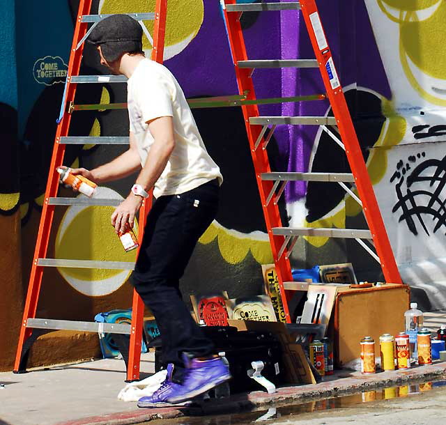 The Belgium-born street artist "Chase" at work at a new mural, Venice Beach, Friday, March 4, 20
