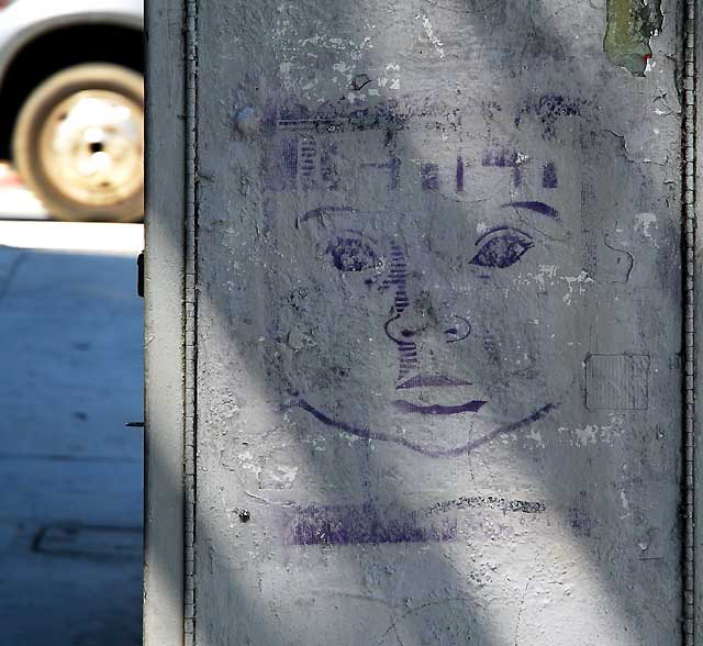 Face on a utility box on the Sunset Strip, Friday, April 1, 2011