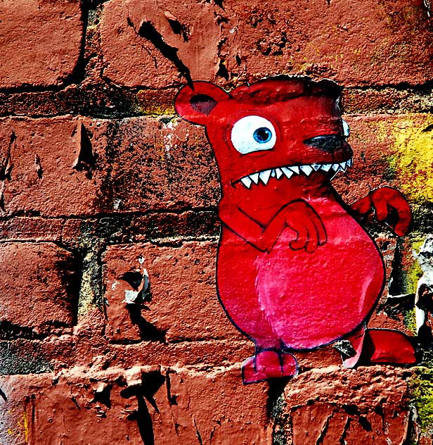 Red Critter on Brick - alley behind La Brea, south of Hollywood, between First and Second Street