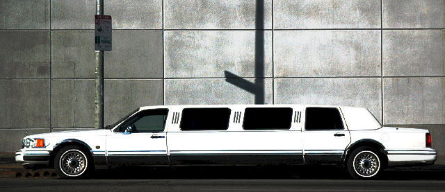 In the long winter sun, a stretch limo at the Guitar Center - Sunset Boulevard