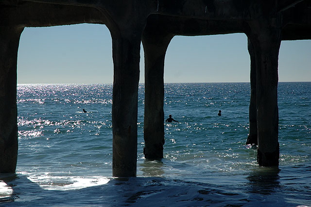 Los Angeles' Manhattan, Manhattan Beach, has surfers at the pier.