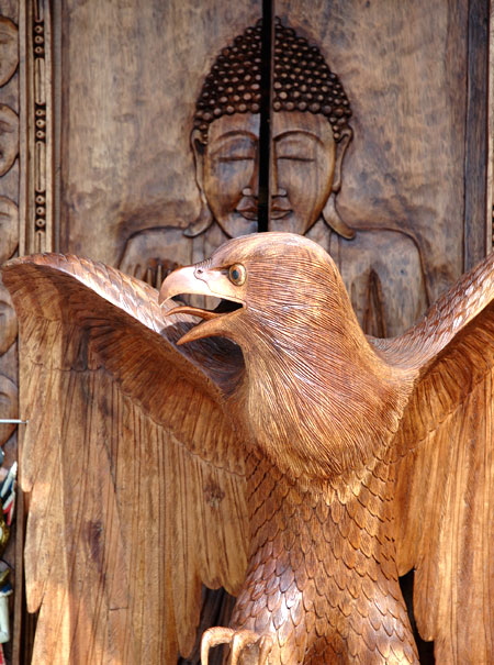 Wooden eagle and Buddha door at shop on the boardwalk, Venice Beach