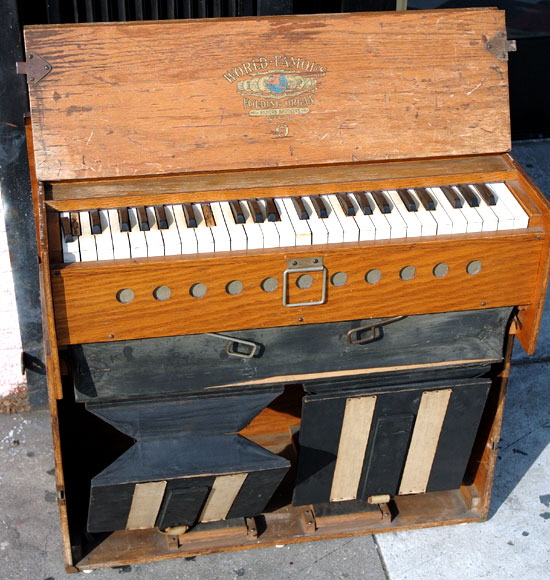 Antique folding organ for sale on the sidewalk - Guitar Row, Sunset Boulevard, Hollywood   