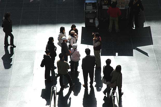 Tourists having things explained to them in front of Hollywood and Highland