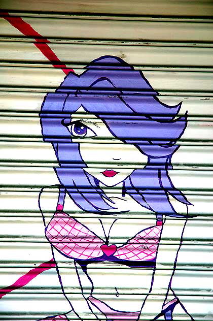 One-eyed girl on roll-up door at closed lingerie shop, Hollywood Boulevard