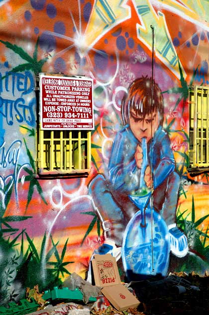 Graffiti on alley wall behind Melrose Avenue  - boy with bong