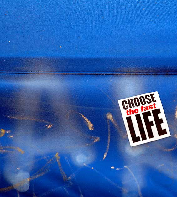 White "Life" sticker on blue awing, Hollywood Boulevard at Cherokee