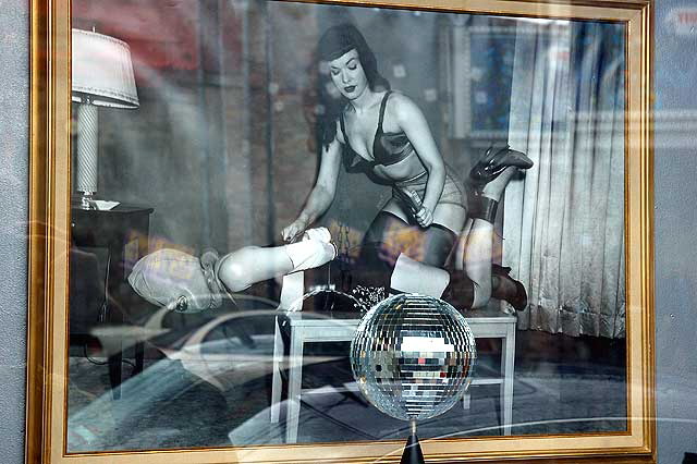 Framed Betty Page S&M photo in gallery window on Las Palmas, Hollywood 
