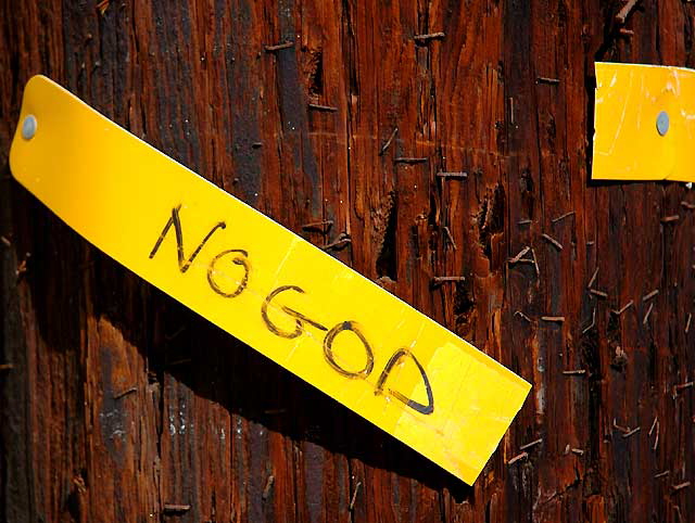 "No God" - torn sign in telephone pole, Venice Beach, California