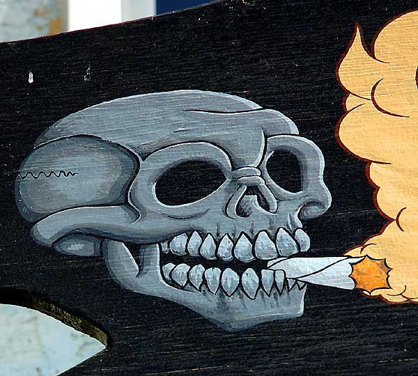 The one significant element of the sign at a smoke shop on Oceanfront Walk, Venice Beach - skull