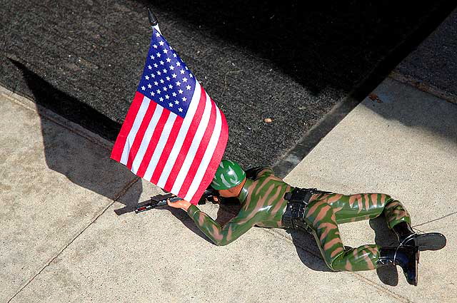 Toy sniper demonstrated on sidewalk, Venice Beach, California