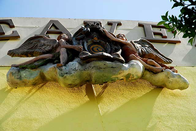 Heaven Furniture - La Brea, one block north of Wilshire, West Los Angeles - cherub logo on yellow wall 