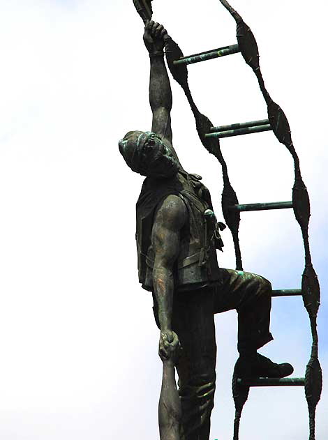 Two merchant seamen climbing a Jacob's ladder after making a rescue at sea – sculpture by Jasper D'Ambrosi – at the American Merchant Marine Veterans Memorial, South Harbor Boulevard at West 6th Street, San Pedro, California