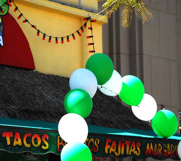 Green and white balloons at Mexican restaurant on Saint Patrick's Day, Third Street Promenade, Santa Monica 