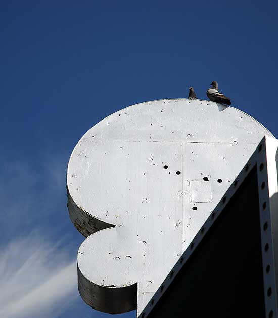 Silver marquee, pigeons and blue sky, Las Palmas at Hollywood Boulevard