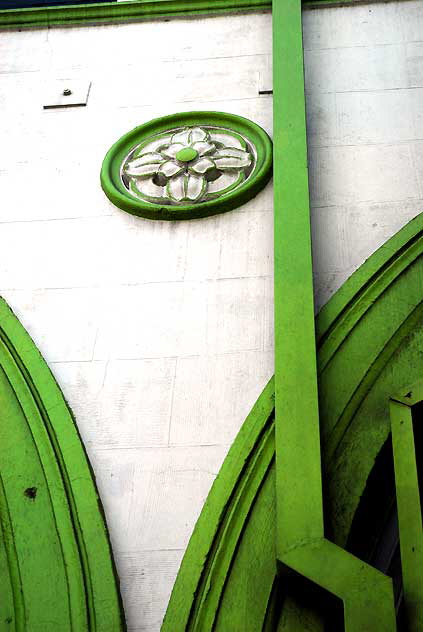 Santa Monica Boulevard, the Theater District, inconsequential Art Deco - a green wall with a flower - 