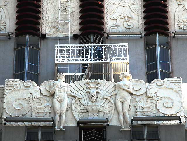 A man and woman meet on the fire escape of the local Art Deco landmark, the Sunset Tower Hotel on the Sunset Strip (8358 Sunset Boulevard) – 1929, architect Leland A. Bryant. A man and woman meet on the fire escape of the local Art Deco landmark, the Sunset Tower Hotel on the Sunset Strip (8358 Sunset Boulevard) – 1929, architect Leland A. Bryant.
