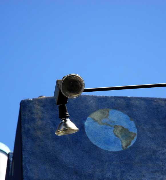 Spotlight and painted globe on blue wall, Hollywood Boulevard