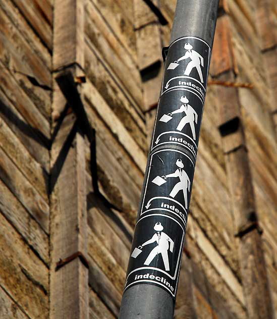 Stickers on pole, Hollywood Boulevard - "indecline"