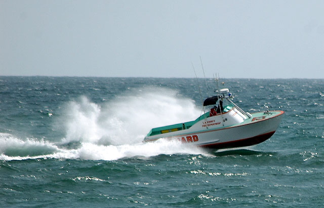 Los Angeles County Fire Department lifeguard boat blasting through the chop off Santa Monica 