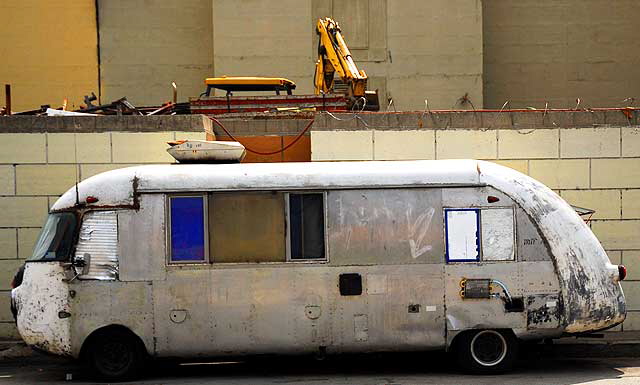 Antique gray streamlined bus parked on Gower, on the west side of Paramount Studios