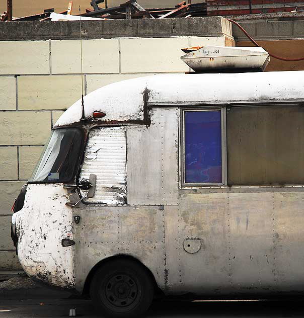 Antique gray streamlined bus parked on Gower, on the west side of Paramount Studios