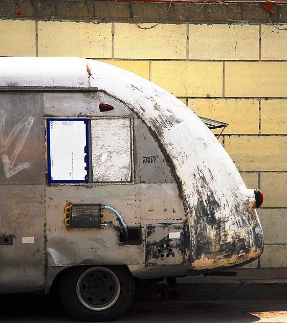 Antique gray streamlined bus parked on Gower, on the west side of Paramount Studios